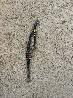 Black Braided Leather Bracelet with Metal Accent with god on it